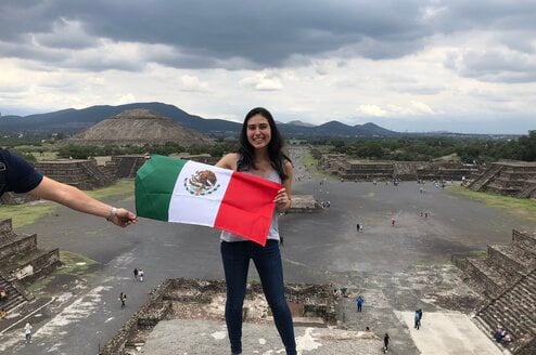 Girl holding Mexico flag